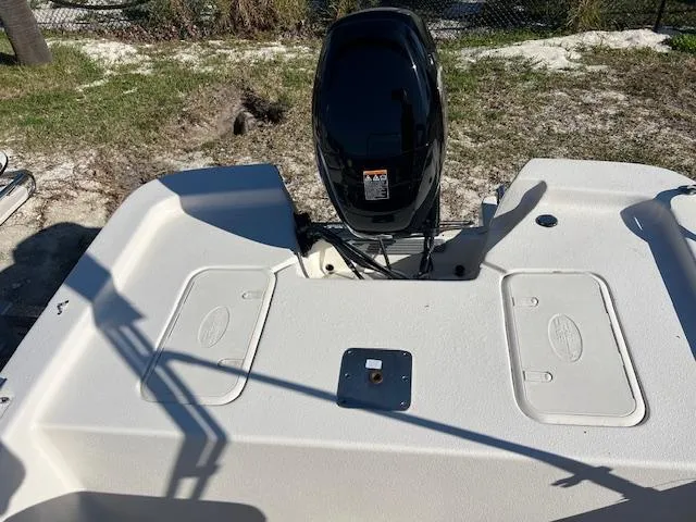 Slide: The Image of 2025 Carolina Skiff E16 JVX CC boat with outboard motor, rear deck view. - 3