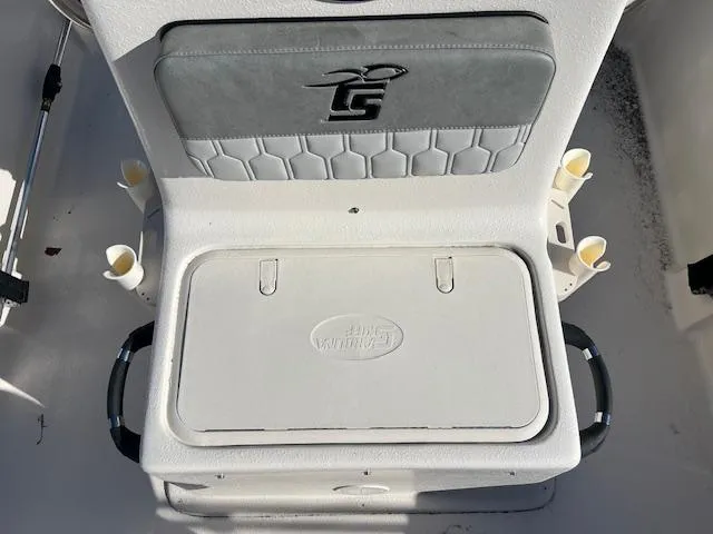 Slide: The Image of 2025 Carolina Skiff E16 JVX CC boat seat with integrated storage and rod holders. - 7
