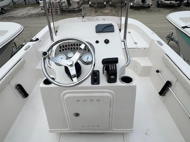 Slide: The Image of 2025 Carolina Skiff 17 LS boat console with steering wheel and gauges. - 4