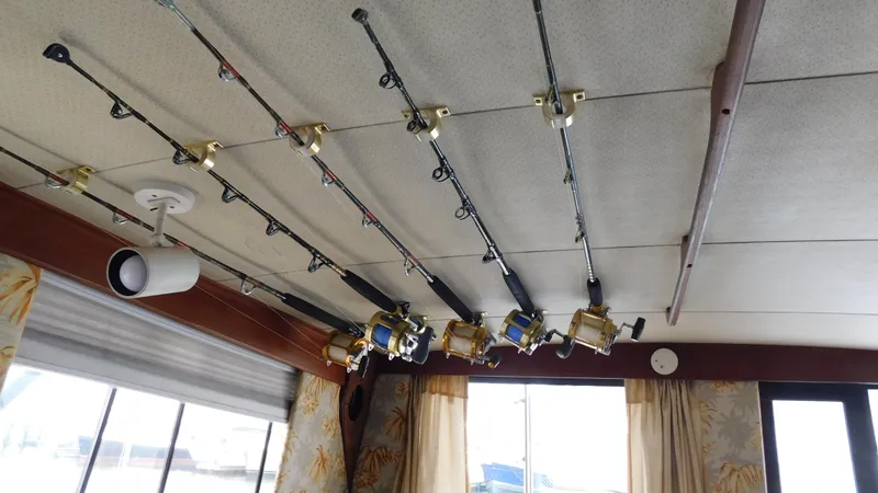 Slide: The Image of Fishing rods mounted on the ceiling of a 1986 Viking 35 Sportfish boat. - 16