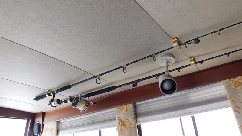 Slide: The Image of Fishing rods mounted on the ceiling of a 1986 Viking 35 Sportfish boat. - 17