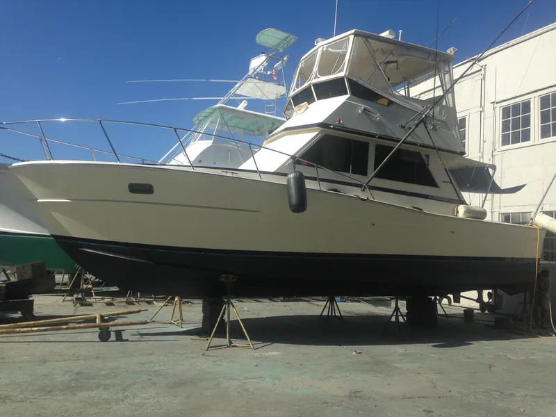 Slide: The Image of 1986 Viking 35 Sportfish boat on dry dock, ready for maintenance. - 2