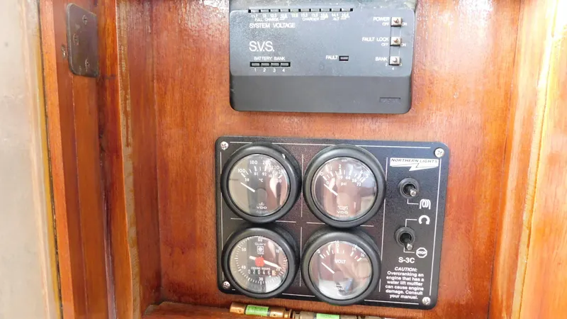 Slide: The Image of Control panel on a 1986 Viking 35 Sportfish boat with gauges and switches. - 21
