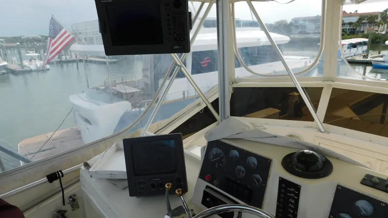 Slide: The Image of Interior view of a 1986 Viking 35 Sportfish boat cockpit with navigation equipment. - 24