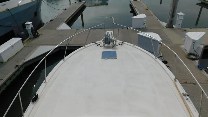 Slide: The Image of 1986 Viking 35 Sportfish boat docked at marina, view from bow. - 27