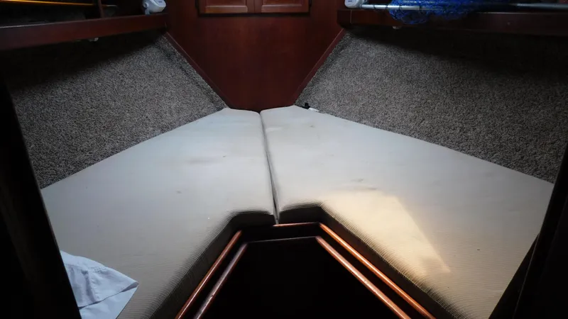 Slide: The Image of Interior cabin of 1986 Viking 35 Sportfish with V-berth and carpeted walls. - 4