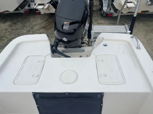 Slide: The Image of 2025 Carolina Skiff 20 JVX CC boat with Suzuki outboard motor, rear deck view. - 3
