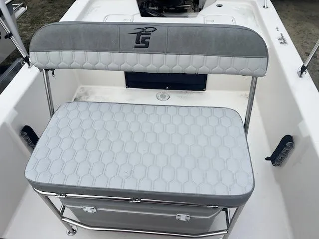 Slide: The Image of 2025 Carolina Skiff 20 JVX CC boat seat with storage and cushioned backrest. - 4
