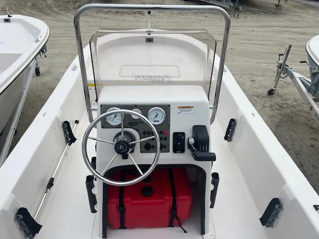Slide: The Image of 2025 Carolina Skiff 20 JVX CC boat console with steering wheel and controls. - 5