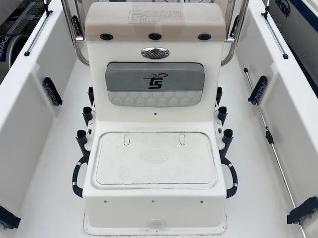 Slide: The Image of 2025 Carolina Skiff 20 JVX CC boat interior with seating and storage compartments. - 7