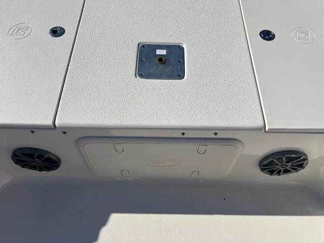 Slide: The Image of 2025 Carolina Skiff 23 LS boat deck with storage compartments and speakers. - 10