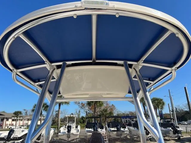 Slide: The Image of 2025 Carolina Skiff 23 LS boat with blue T-top and stainless steel frame. - 12