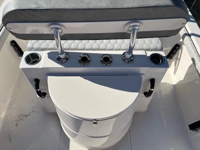 Slide: The Image of 2025 Carolina Skiff 23 LS boat seating and storage area with cup holders. - 4
