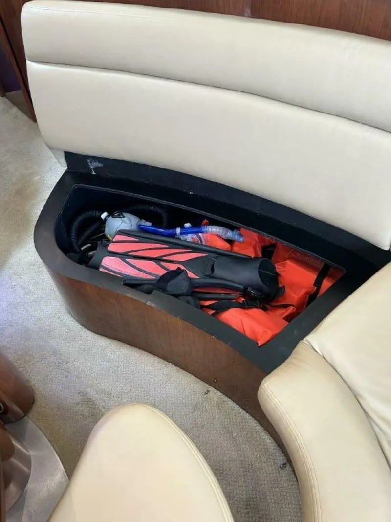 Slide: The Image of Storage compartment in 2004 Sea Ray 390 Motor Yacht with life jackets and equipment. - 17