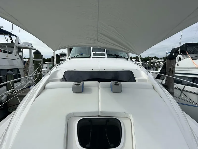 Slide: The Image of 2004 Sea Ray 390 Motor Yacht with canopy, docked at marina. - 4