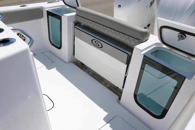 Slide: The Image of 2025 Sportsman Open 262 Center Console boat interior with seating and storage compartments. - 13