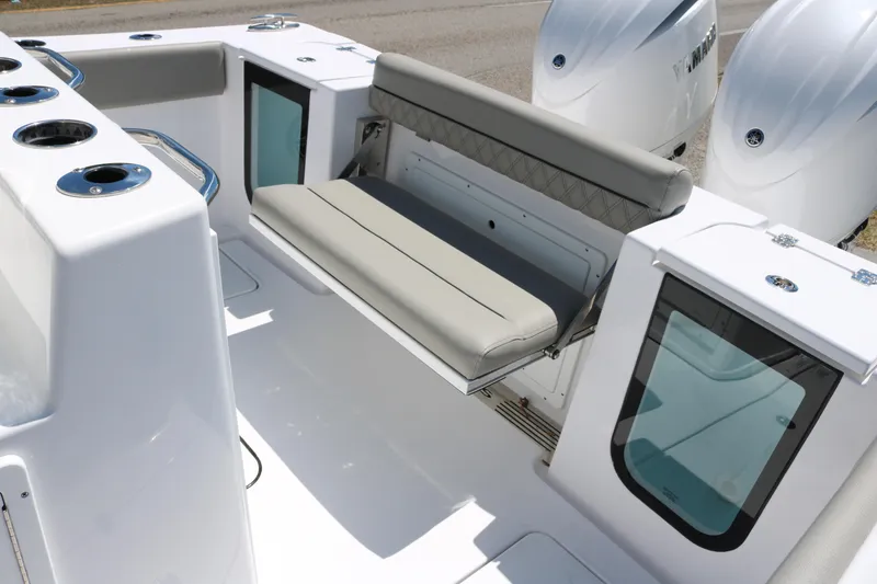 Slide: The Image of 2025 Sportsman Open 262 Center Console boat interior with seating and dual engines. - 14