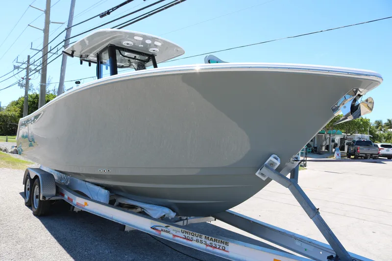 Slide: The Image of 2025 Sportsman Open 262 Center Console boat on trailer, side view. - 2
