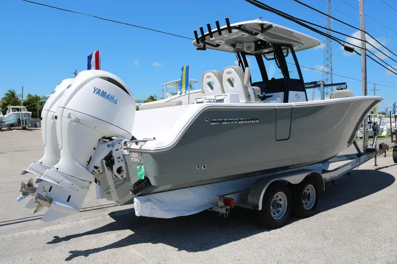 Slide: The Image of 2025 Sportsman Open 262 Center Console boat on trailer with Yamaha engine. - 3