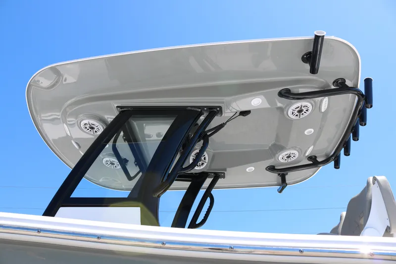 Slide: The Image of 2025 Sportsman Open 262 Center Console T-top with speakers and rod holders. - 4
