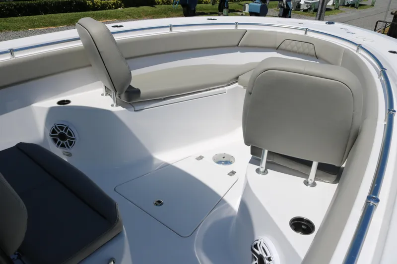 Slide: The Image of 2025 Sportsman Open 262 Center Console boat interior with cushioned seating and speakers. - 8