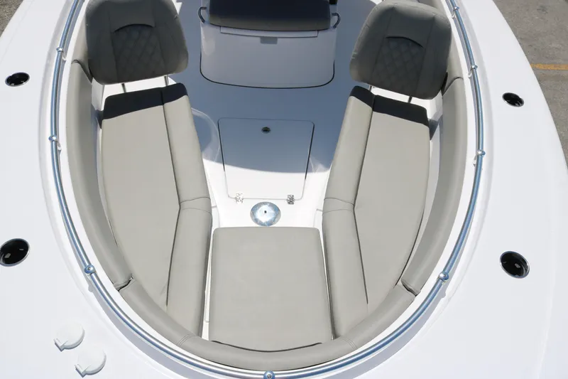 Slide: The Image of 2025 Sportsman Open 262 Center Console boat interior with cushioned seating. - 9