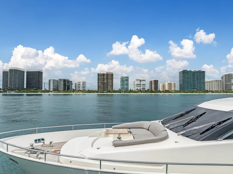 Slide: The Image of Sanlorenzo SL78 yacht, 2018 model, cruising near modern city skyline under blue skies. - 4