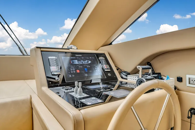 Slide: The Image of Sanlorenzo SL78 2018 yacht helm with modern navigation controls and beige interior. - 42
