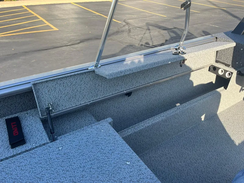 Slide: The Image of 2025 Lund 1775 Impact XS Sport boat interior with gray textured finish. - 23