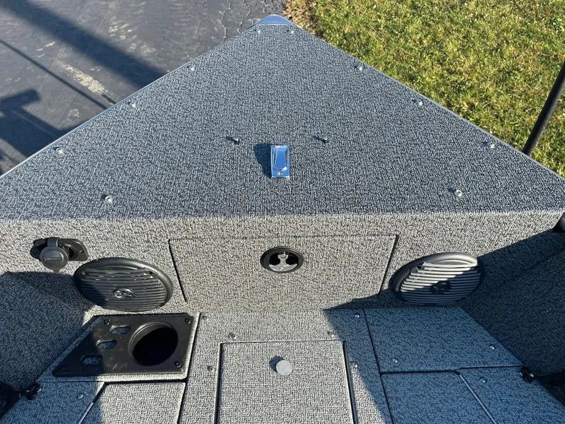 Slide: The Image of 2025 Lund 1775 Impact XS Sport boat interior with speakers and storage compartments. - 24