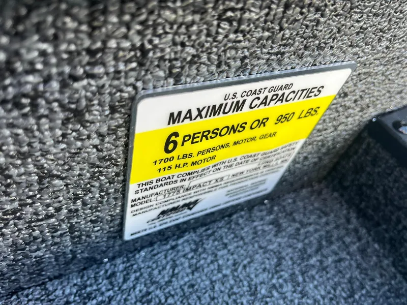Slide: The Image of Capacity label on 2025 Lund 1775 Impact XS Sport boat, 6 persons or 950 lbs. - 28