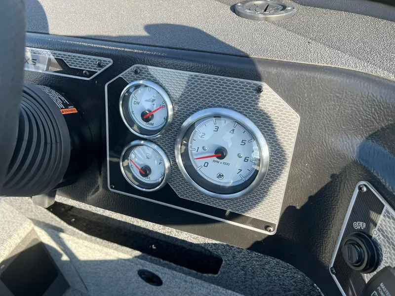 Slide: The Image of Dashboard of 2025 Lund 1775 Impact XS SS boat with gauges and controls. - 20