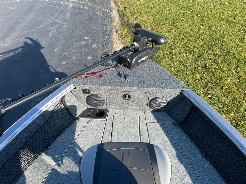 Slide: The Image of 2025 Lund 1775 Impact XS SS boat interior with trolling motor and seating. - 22