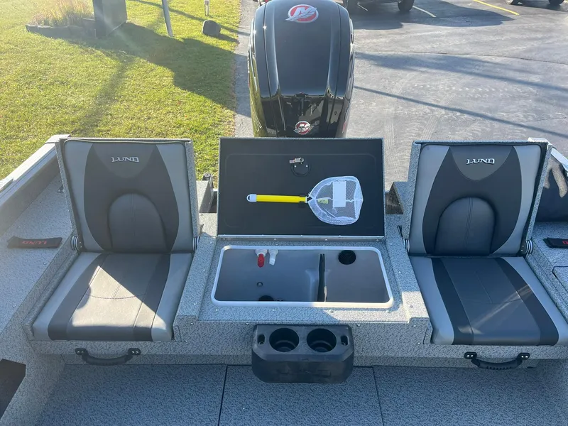 Slide: The Image of 2025 Lund 1775 Impact XS SS boat interior with seating and storage compartment. - 8