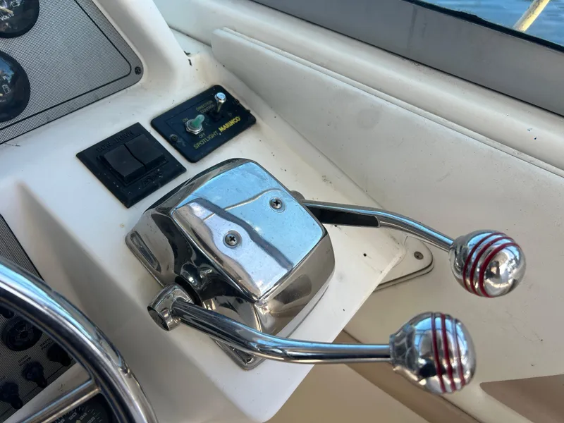 Slide: The Image of Close-up of 1999 Wellcraft 330 Coastal boat throttle controls. - 18