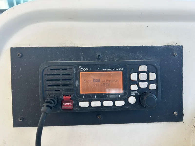 Slide: The Image of ICOM marine radio on 1999 Wellcraft 330 Coastal boat dashboard. - 19