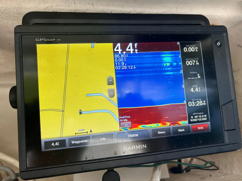 Slide: The Image of Garmin GPSMAP display on 1999 Wellcraft 330 Coastal boat showing depth and navigation data. - 22