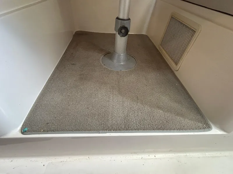 Slide: The Image of 1999 Wellcraft 330 Coastal interior with carpeted floor and pedestal base. - 48