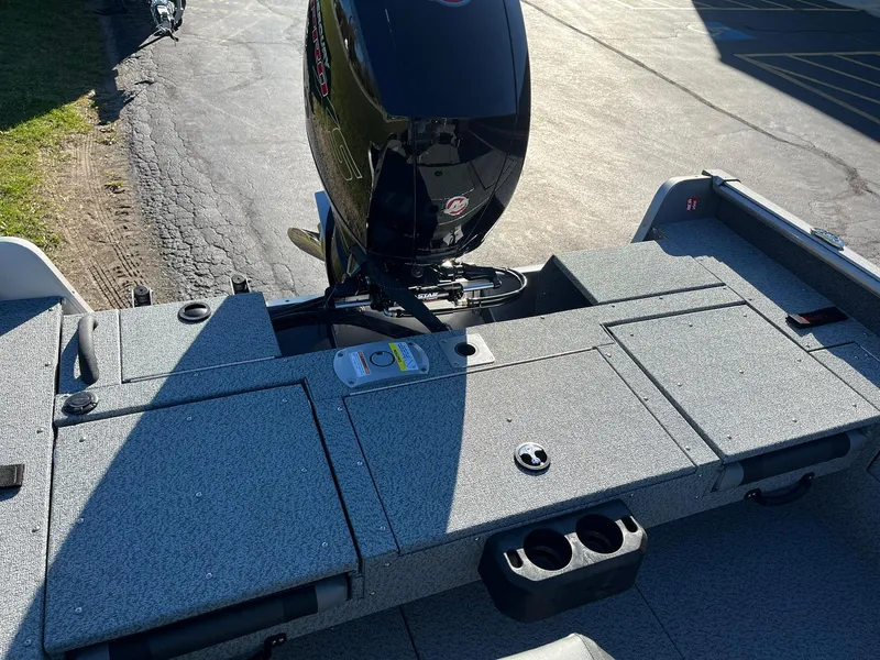 Slide: The Image of 2025 Lund 1875 Impact XS SS boat with outboard motor, rear deck view. - 12