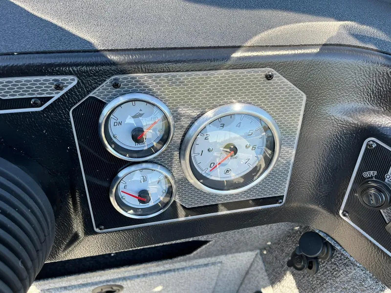 Slide: The Image of Dashboard of 2025 Lund 1875 Impact XS SS boat with gauges and controls. - 15