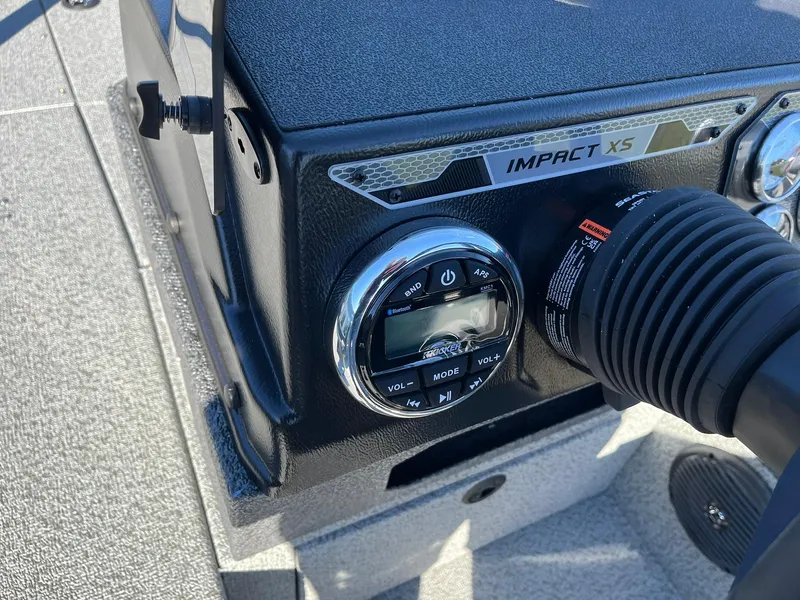 Slide: The Image of 2025 Lund 1875 Impact XS SS dashboard with control panel and steering wheel. - 16