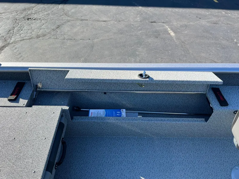 Slide: The Image of 2025 Lund 1875 Impact XS SS boat interior with storage compartment. - 19