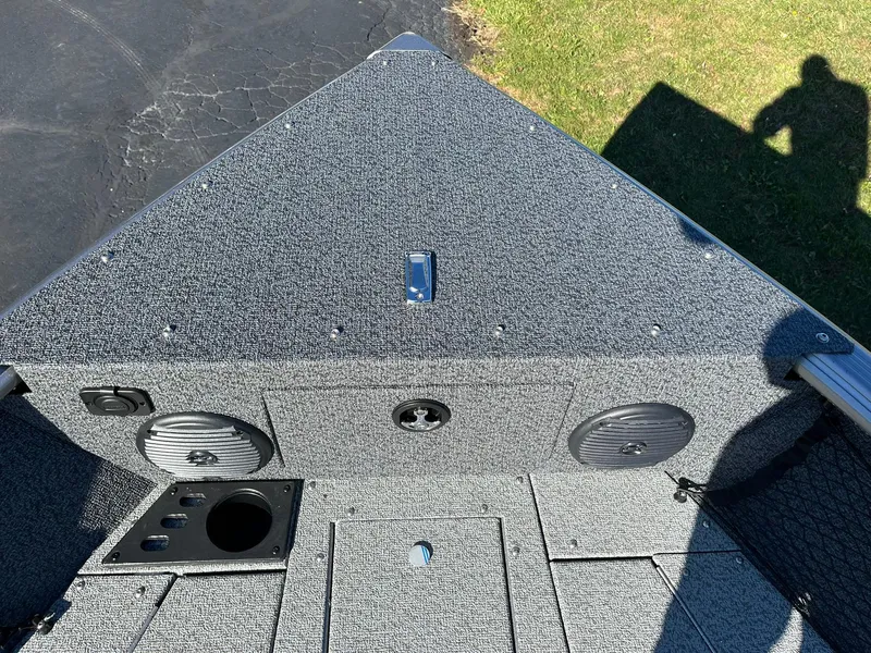 Slide: The Image of 2025 Lund 1875 Impact XS SS boat interior with speakers and storage compartments. - 22