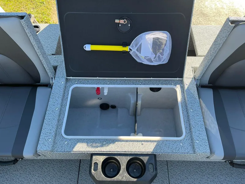 Slide: The Image of 2025 Lund 1875 Impact XS SS boat interior with storage compartment and fishing net. - 9