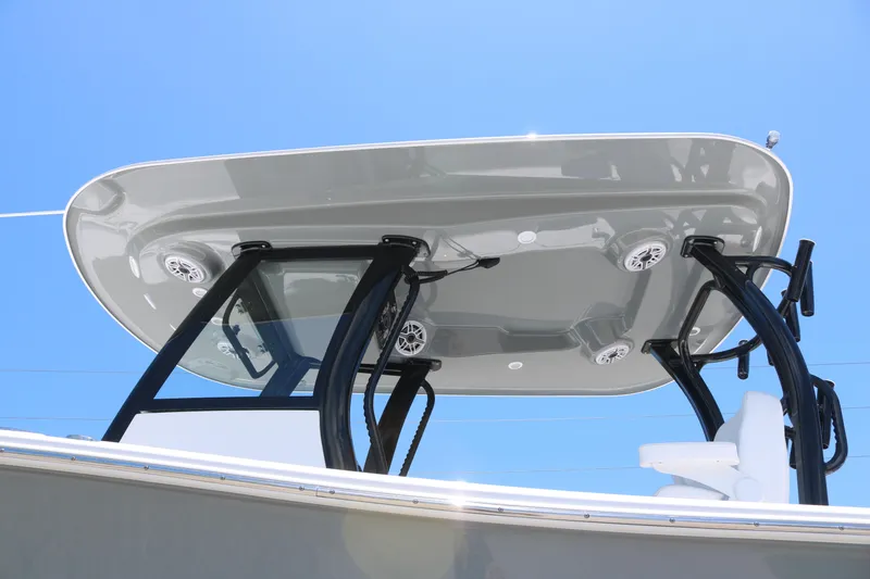 Slide: The Image of 2025 Sportsman Open 282 boat with sleek T-top design against clear blue sky. - 4