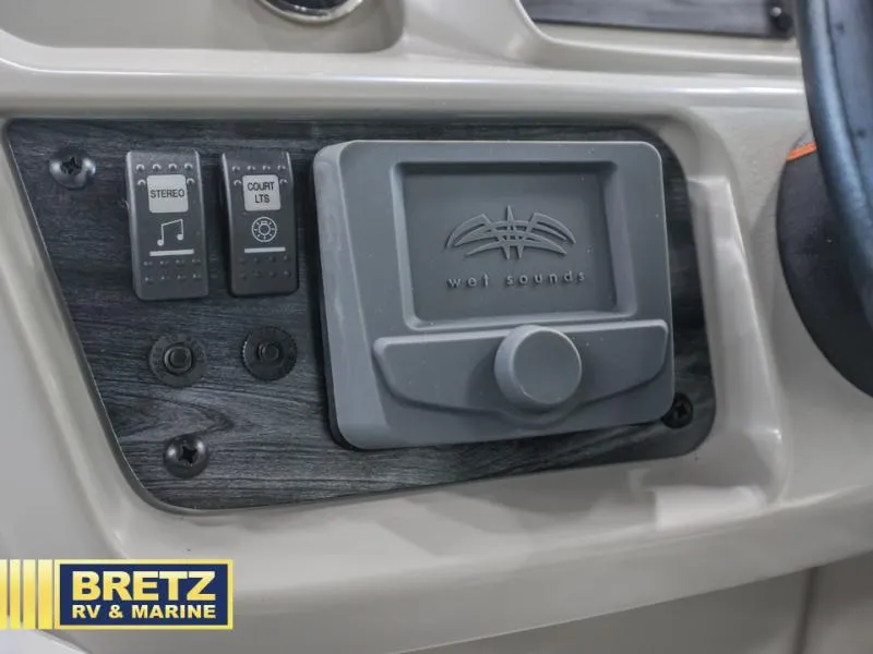 Slide: The Image of Control panel of 2025 Vista Fish 18 boat with stereo and court lights switches. - 11