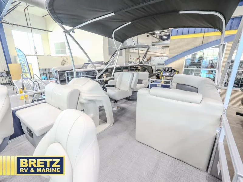 Slide: The Image of 2025 Vista Fish 18 pontoon boat interior at Bretz RV & Marine showroom. - 15