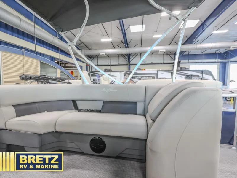 Slide: The Image of 2025 Vista Fish 18 boat interior with gray seating, displayed at Bretz RV & Marine showroom. - 16