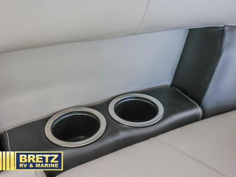 Slide: The Image of Cup holders in a 2025 Vista Fish 18 boat, featuring sleek leather upholstery. - 17
