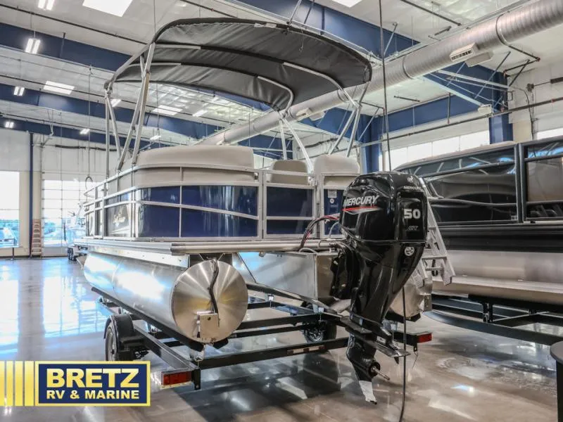 Slide: The Image of 2025 Vista Fish 18 pontoon boat with Mercury 50 outboard motor in showroom. - 4